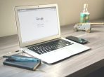 macbook air on grey wooden table
